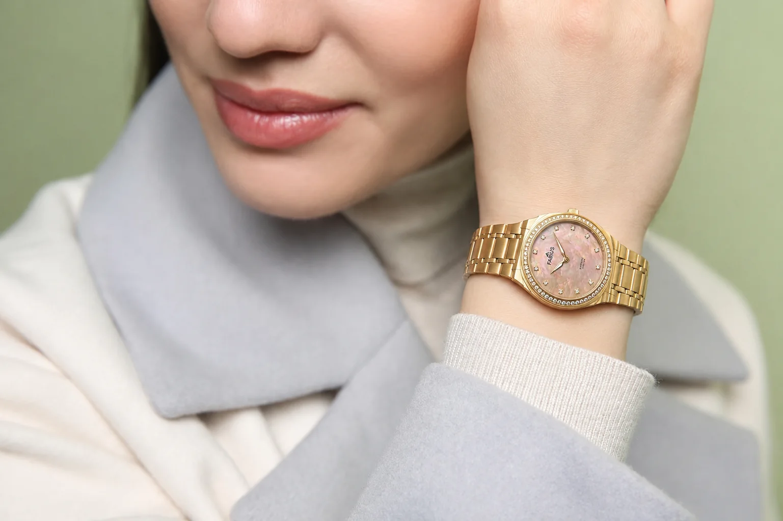 Woman wearing a gold Fabius watch